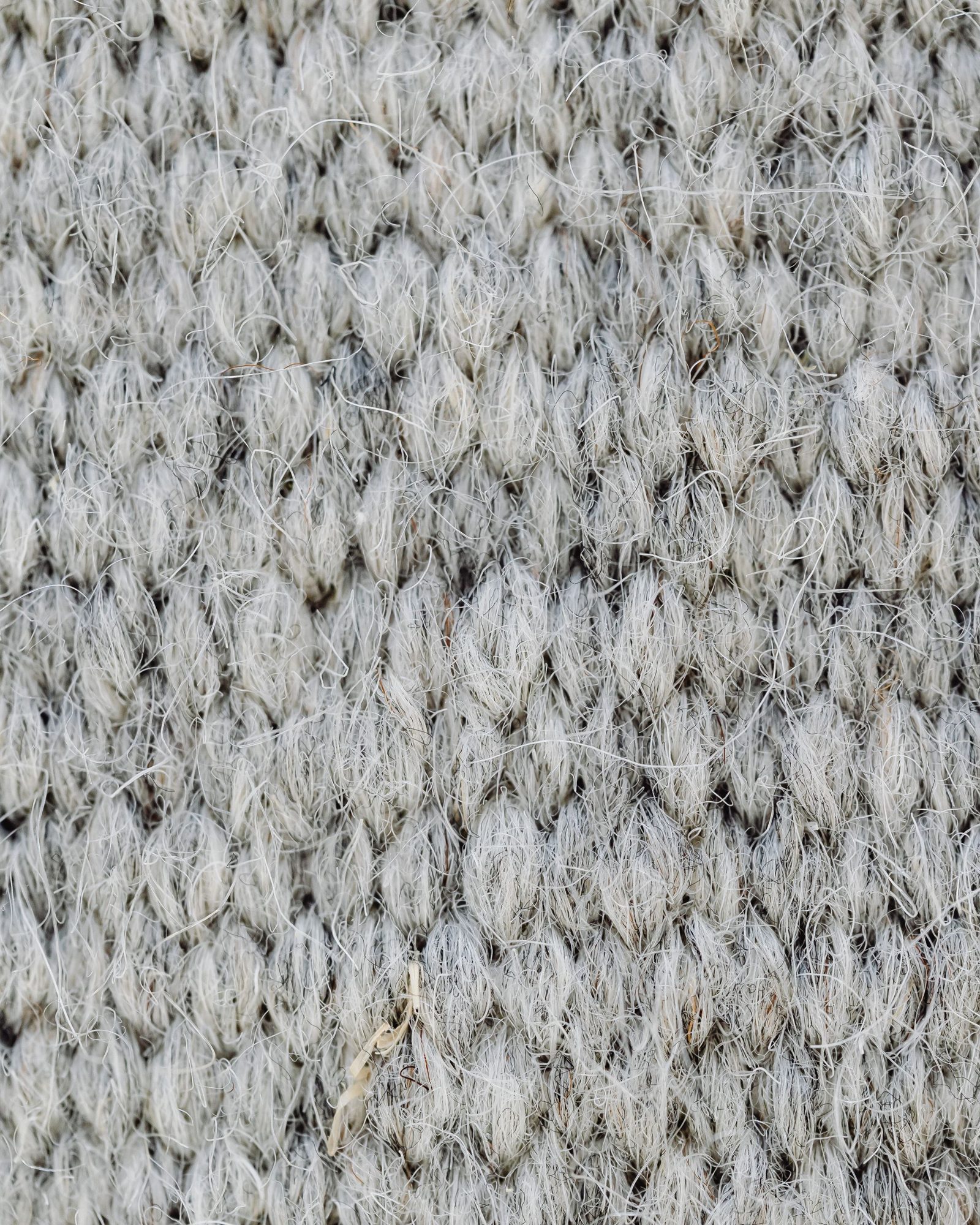 Gros plan d’un tissage de laine gris